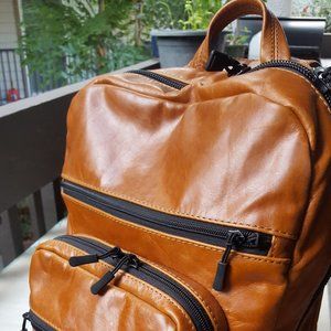 Leather backpack with reversible lining